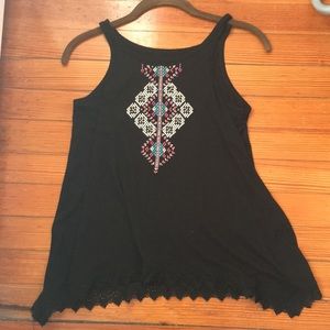 A black shirt with a bohemian print.